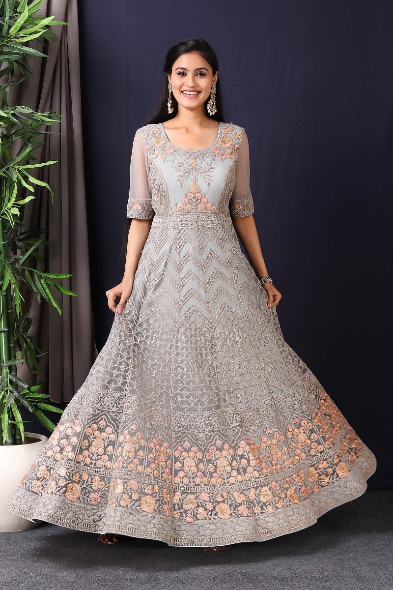 Shop this gorgeous this designer grey embroidered net anarkali with skirt with lace work on it. A fully embroidery work on anarkali suit with heacy dupatta makes this a sophisticated piece of luxury that will captivate you in its calmness and serenity. Style this set with a pair of diamond earrings and solid pumps to finish the look from Pure Elegance Indian fashion store in USA online now.-Full view.