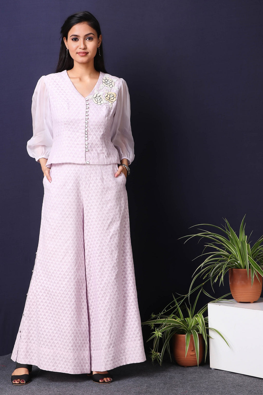 Shop this gorgeous chanderi and tabby silk lilac formal co-ord with wide legged plazo in a breezy and delicate cream tone featuring anchor thread floral embroidery work and beautiful neckline. Style this beautiful chanderi and tabby silk material outfit showcases ballon sleeves with a pair of diamond earrings and solid pumps to finish the look from Pure Elegance.. Buy this designer from Pure Elegance Online Indian store now.-Front view.
