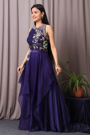 Shop this designer indo western drape and sharara in navy blue colour. This dress comes in organza and satin fabric. The borders of the saree have an exquisite design that is eye-catchy and has multicolour thread embroidery with cutdana work on it. Complete the look with a moti necklace and pair of heels. Shop this designer from Pure Elegance. Shop this designer from Pure Elegance Online Indian store now.-Side view.