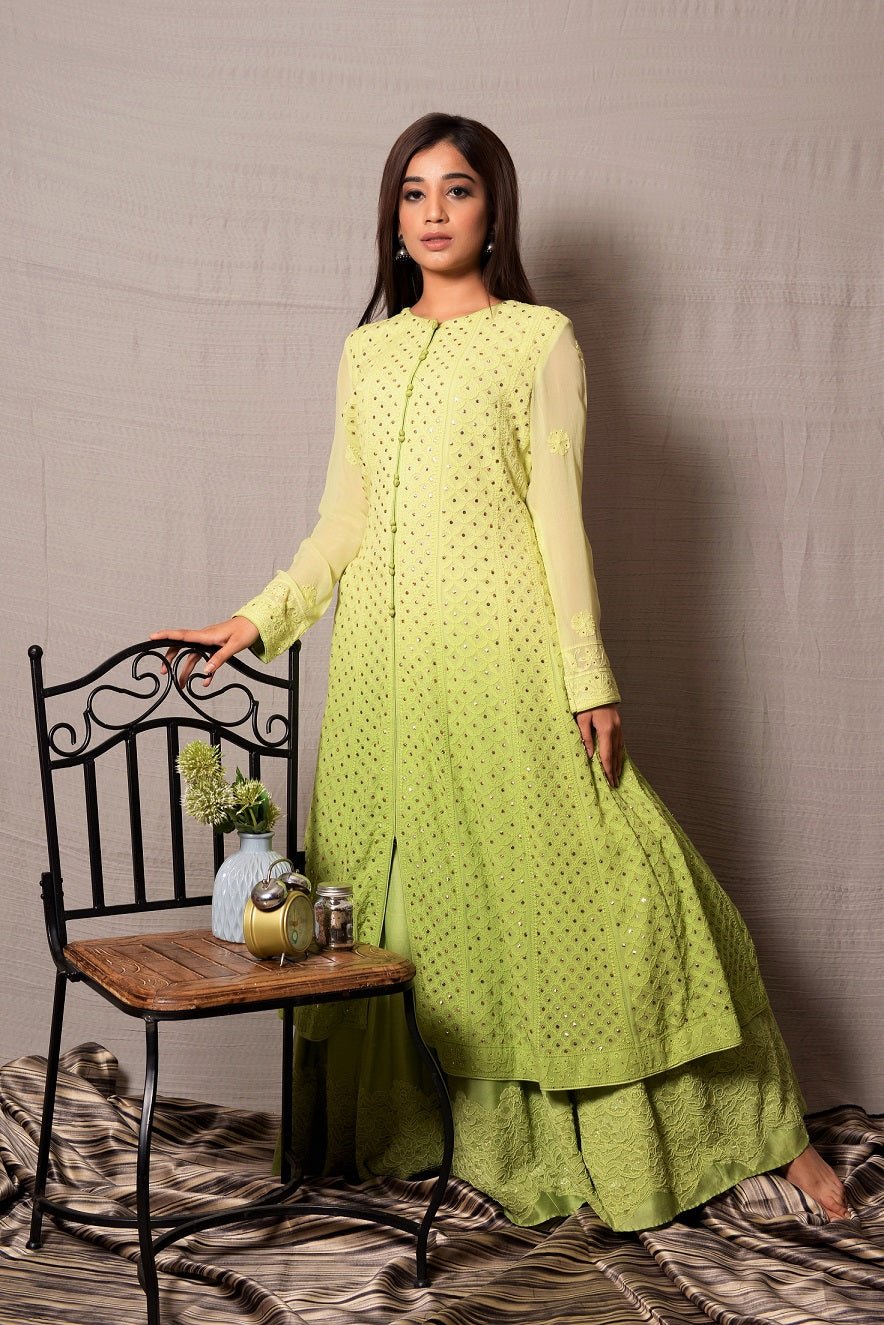 Shop this designer designer light green long georgette and silk chanderi anarkali with skirt with lace work on it. This asymmetrical layered piece in light green shade is embellished with hand lucknowi work and mukaish highlight. Style this fully mirror work on anarkali suit set with a pair of diamond earrings and solid pumps to finish the look from Pure Elegance. Indian clothing store in USA online now.-Full view.