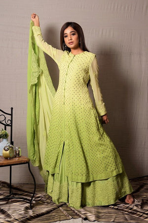 Shop this designer designer light green long georgette and silk chanderi anarkali with skirt with lace work on it. This asymmetrical layered piece in light green shade is embellished with hand lucknowi work and mukaish highlight. Style this fully mirror work on anarkali suit set with a pair of diamond earrings and solid pumps to finish the look from Pure Elegance. Indian clothing store in USA online now.-Full view with dupatta.