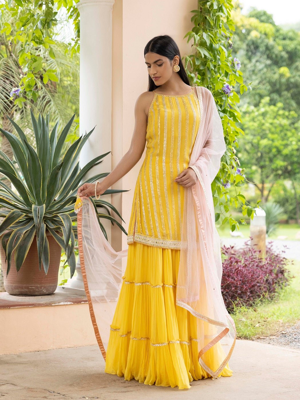 Shop beautiful yellow embroidered sharara suit online in USA with dupatta. Dazzle on weddings and special occasions with exquisite Indian designer dresses, sharara suits, Anarkali suits, wedding lehengas from Pure Elegance Indian fashion store in USA.-full view