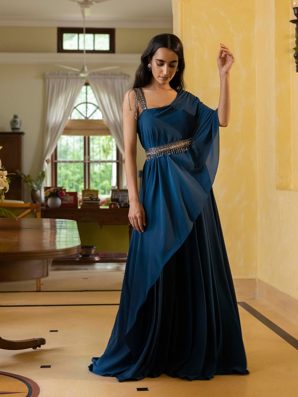 Buy beautiful navy blue asymmetric gown online in USA with embellished belt. Dazzle on weddings and special occasions with exquisite Indian designer dresses, sharara suits, Anarkali suits, wedding lehengas from Pure Elegance Indian fashion store in USA.-full view