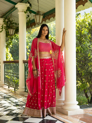 Buy beautiful fuschia pink embroidered palazzo crop top online in USA with cape. Dazzle on weddings and special occasions with exquisite Indian designer dresses, sharara suits, Anarkali suits, wedding lehengas from Pure Elegance Indian fashion store in USA.-cape