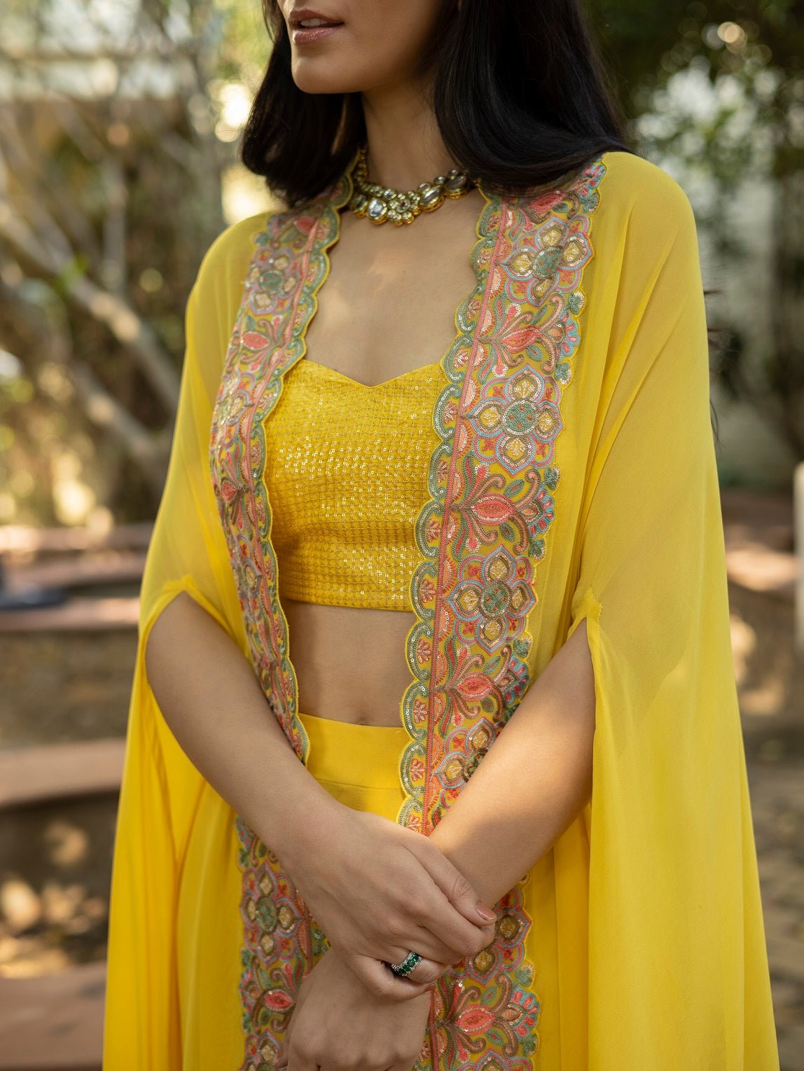 Shop stunning canary yellow palazzo crop top online in USA with multi thread cape. Dazzle on weddings and special occasions with exquisite Indian designer dresses, sharara suits, Anarkali suits, wedding lehengas from Pure Elegance Indian fashion store in USA.-cape