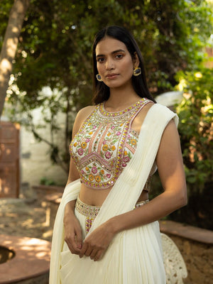 Shop beautiful pearl white embroidered draped pant saree online in USA. Dazzle on weddings and special occasions with exquisite Indian designer dresses, sharara suits, Anarkali suits, wedding lehengas from Pure Elegance Indian fashion store in USA.-blouse