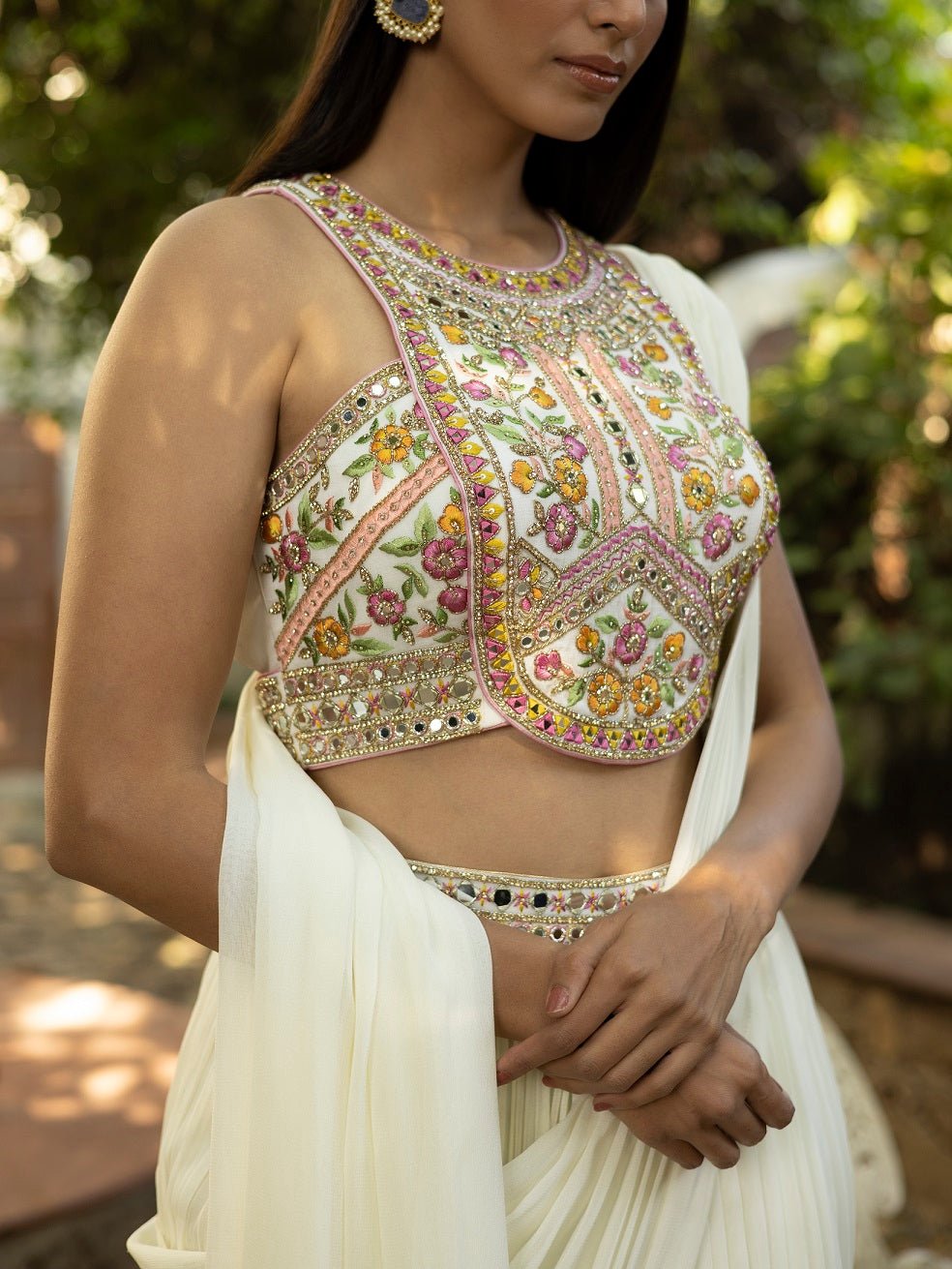 Shop beautiful pearl white embroidered draped pant saree online in USA. Dazzle on weddings and special occasions with exquisite Indian designer dresses, sharara suits, Anarkali suits, wedding lehengas from Pure Elegance Indian fashion store in USA.-side