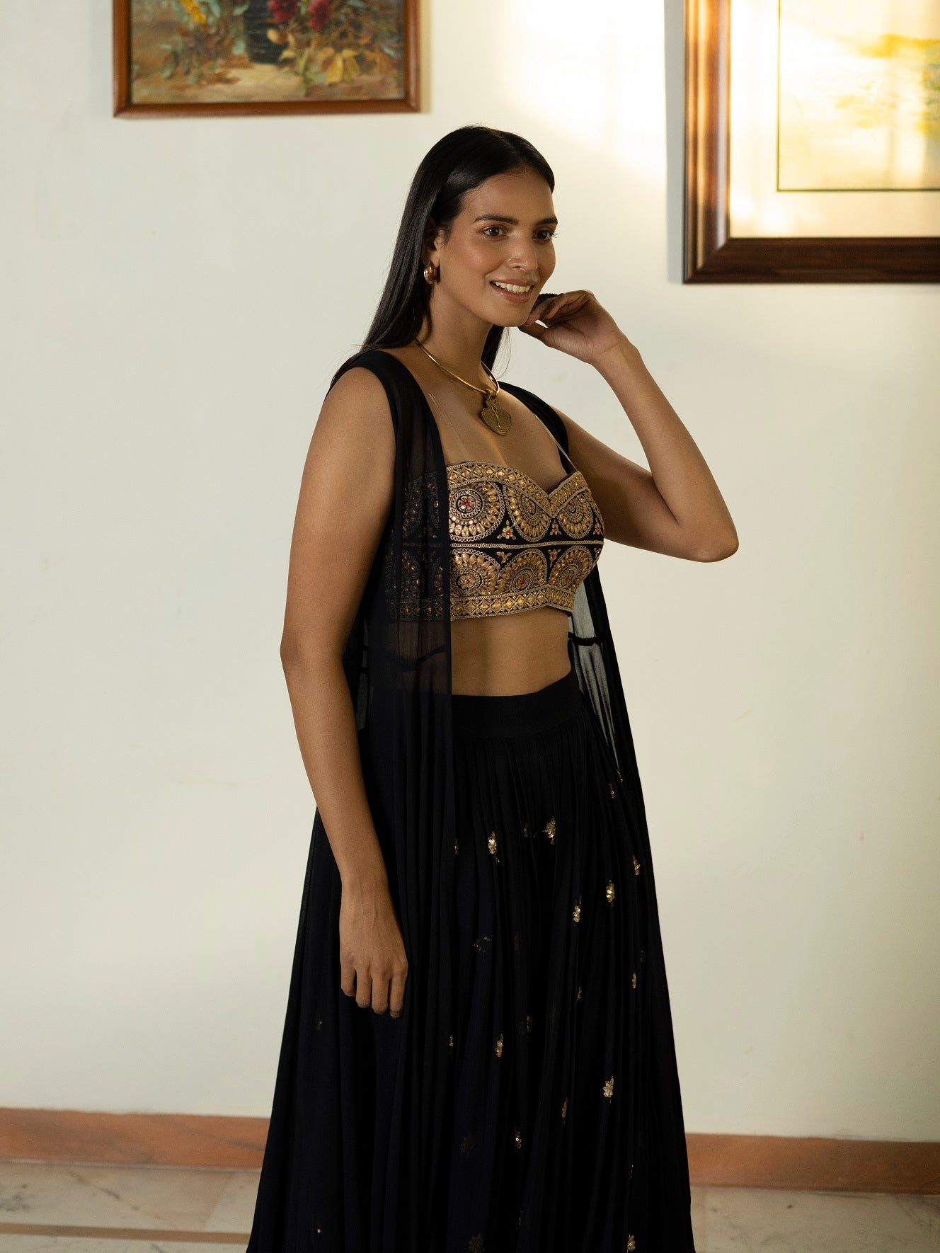 Buy beautiful midnight blue embroidered bustier and sharara online in USA with cape. Dazzle on weddings and special occasions with exquisite Indian designer dresses, sharara suits, Anarkali suits, wedding lehengas from Pure Elegance Indian fashion store in USA.-cape
