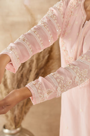 Shop beautiful powder pink organza Anarkali suit online in USA with dupatta. Dazzle on weddings and special occasions with exquisite Indian designer dresses, sharara suits, Anarkali suits, wedding lehengas from Pure Elegance Indian fashion store in USA.-closeup