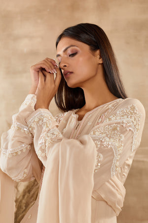 Shop stunning ivory organza Anarkali suit online in USA with dupatta. Dazzle on weddings and special occasions with exquisite Indian designer dresses, sharara suits, Anarkali suits, wedding lehengas from Pure Elegance Indian fashion store in USA.-closeup