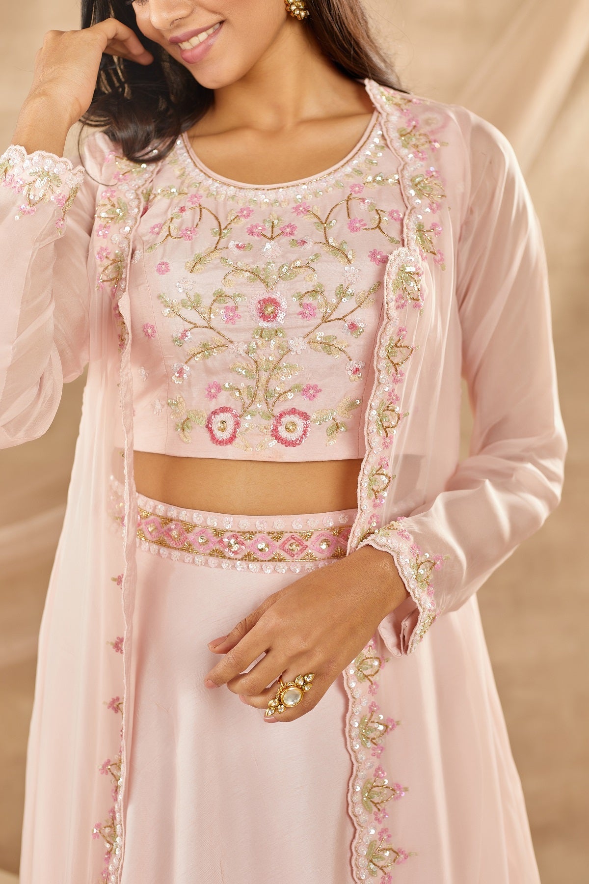 Buy powder pink embroidered organza lehenga with online in USA with dupatta. Dazzle on weddings and special occasions with exquisite Indian designer dresses, sharara suits, Anarkali suits, wedding lehengas from Pure Elegance Indian fashion store in USA.-closeup