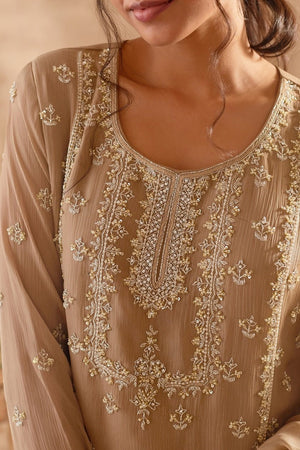Buy stunning beige embroidered sharara suit online in USA with dupatta. Dazzle on weddings and special occasions with exquisite Indian designer dresses, palazzo suits, Anarkali suits, wedding lehengas from Pure Elegance Indian fashion store in USA.-neckline