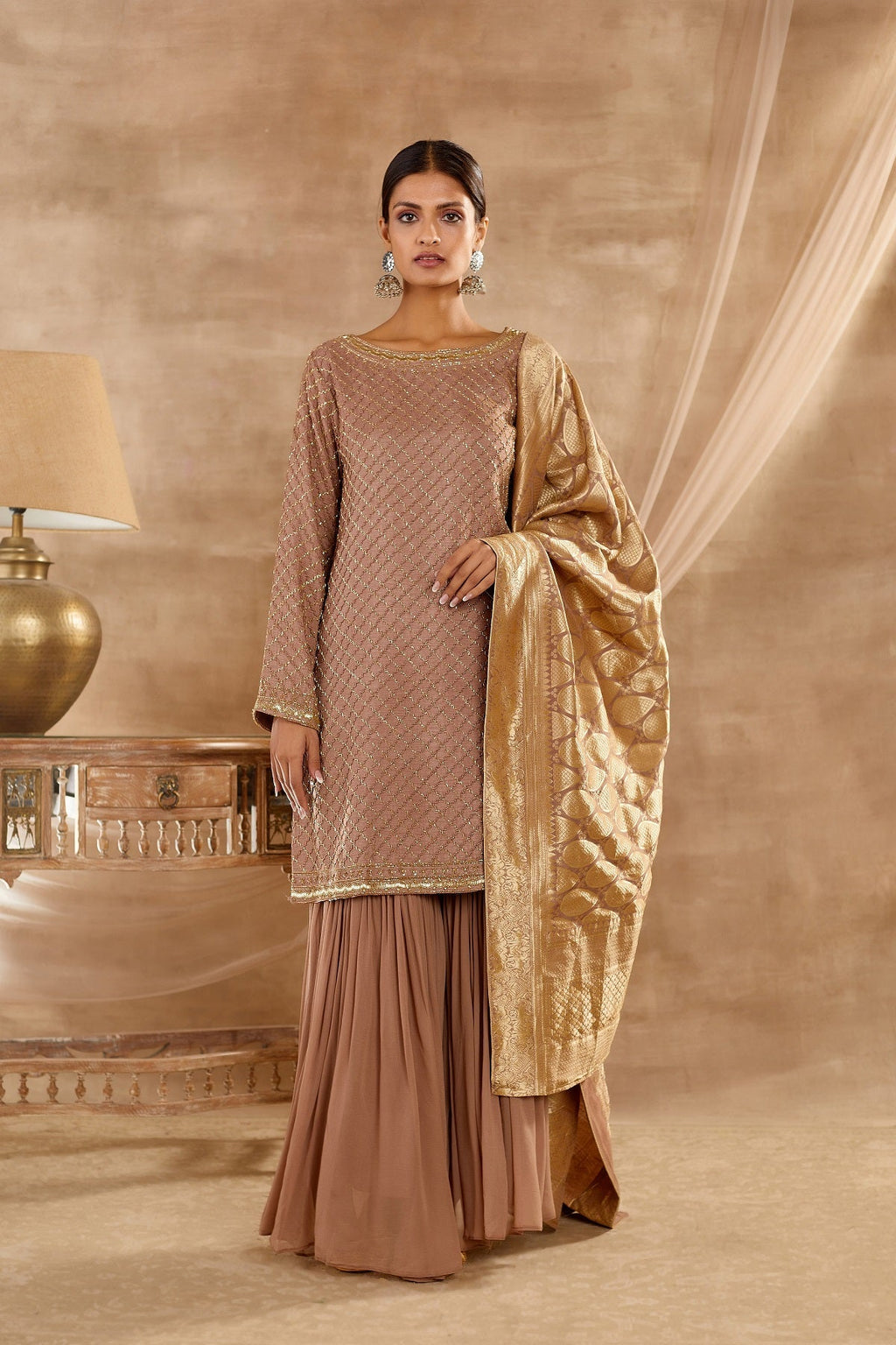 Shop stunning beige Uppada silk sharara suit online in USA with dupatta. Dazzle on weddings and special occasions with exquisite Indian designer dresses, palazzo suits, Anarkali swsuits, wedding lehengas from Pure Elegance Indian fashion store in USA.-full view