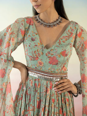 Buy beautiful green floral cape sleeves dress online in USA with embroidered belt. Make a fashion statement on festive occasions and weddings with designer suits, Indian dresses, Anarkali suits, palazzo suits, designer gowns, sharara suits from Pure Elegance Indian fashion store in USA.-closeup