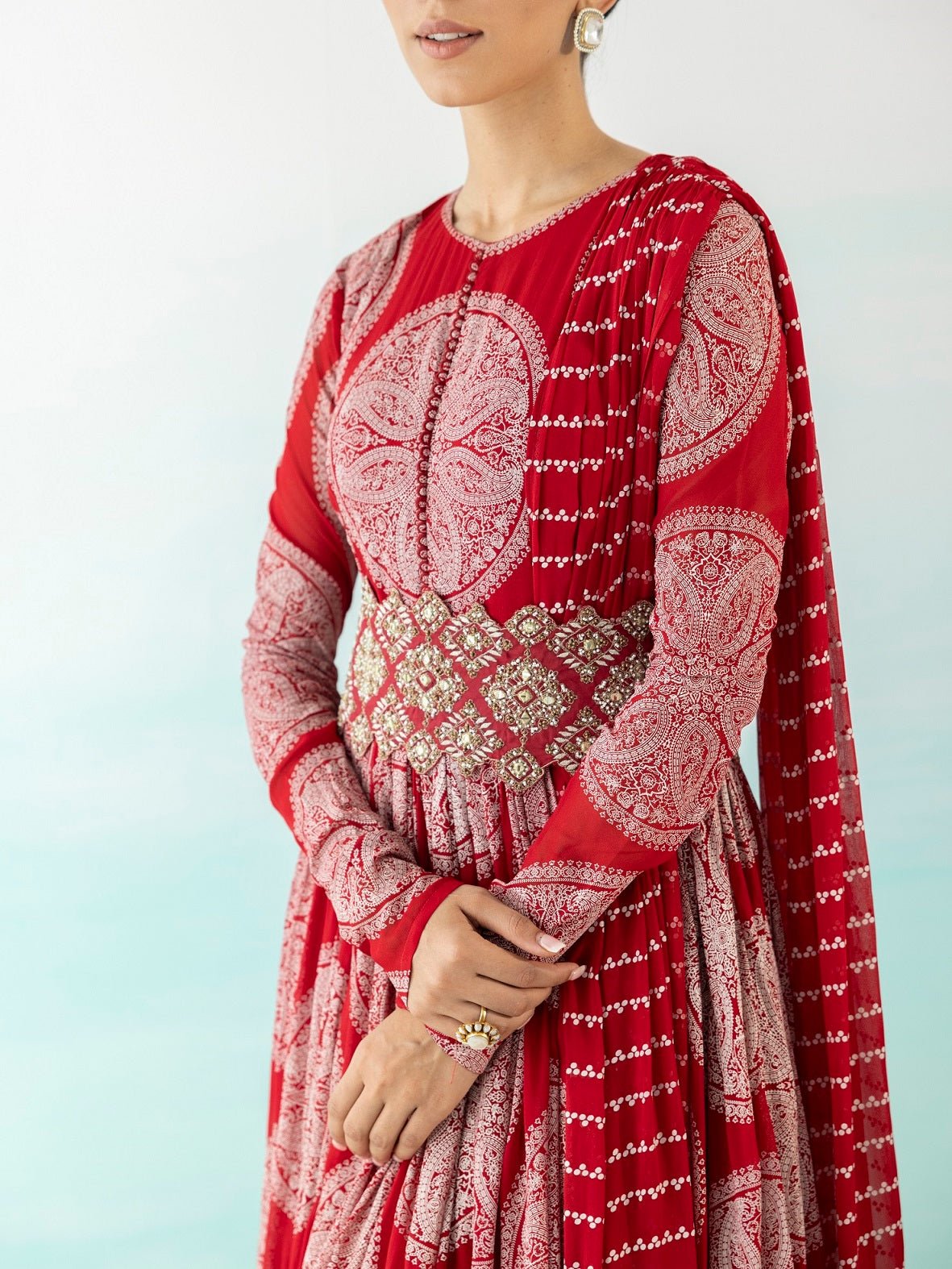 Buy stunning red printed Anarkali suit online in USA with zari dupatta. Make a fashion statement on festive occasions and weddings with designer suits, Indian dresses, Anarkali suits, palazzo suits, designer gowns, sharara suits from Pure Elegance Indian fashion store in USA.-closeup