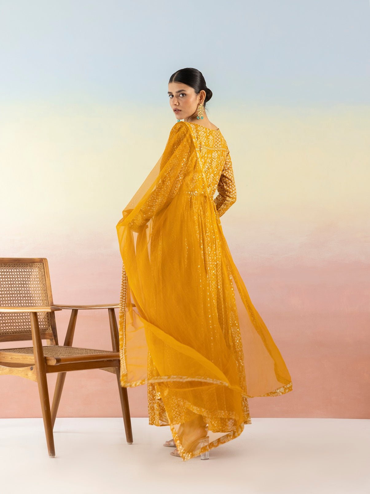 Buy beautiful mustard sequin work georgette Anarkali online in USA with dupatta. Make a fashion statement on festive occasions and weddings with designer suits, Indian dresses, Anarkali suits, palazzo suits, designer gowns, sharara suits from Pure Elegance Indian fashion store in USA.-back