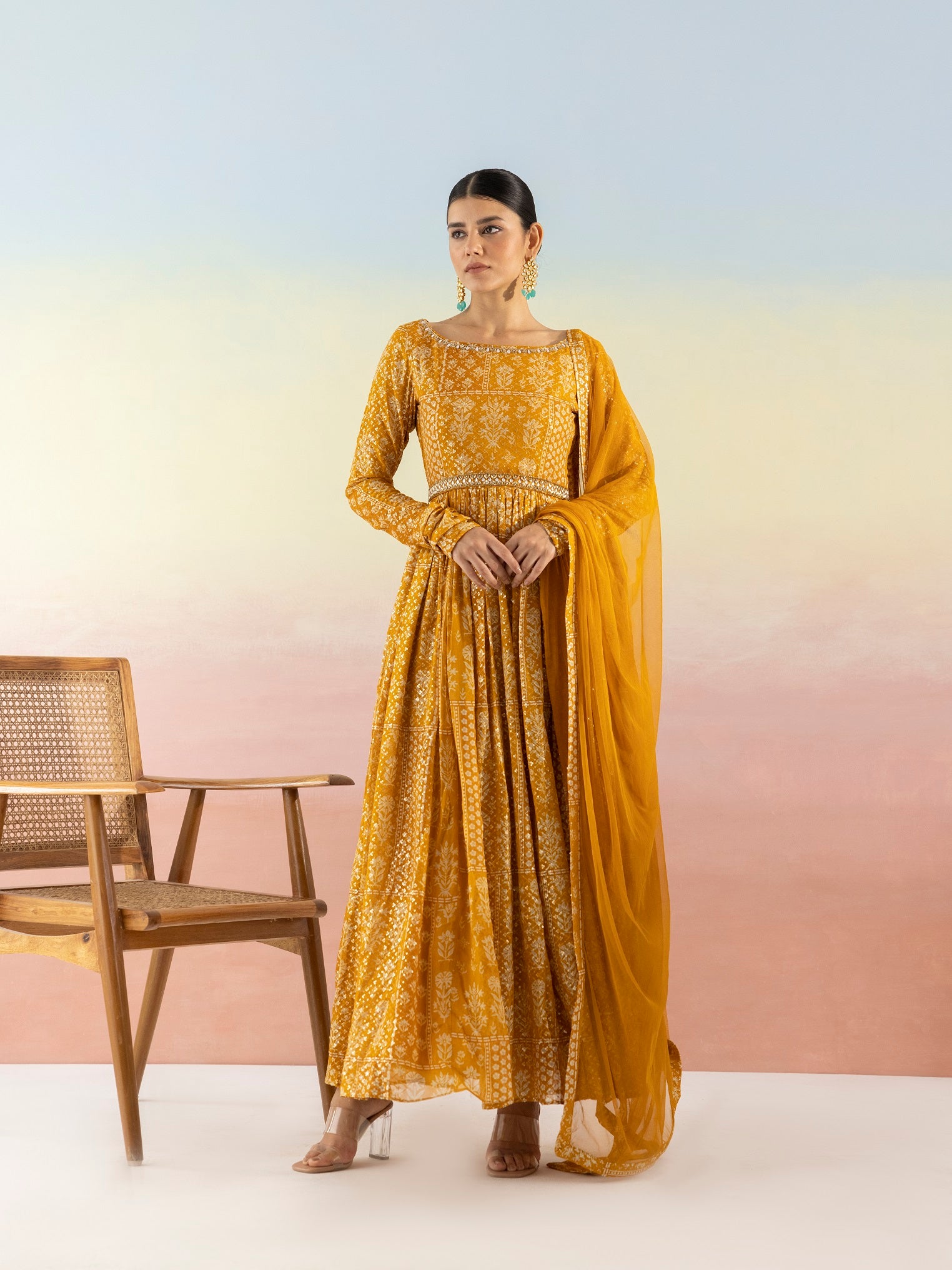 Buy beautiful mustard sequin work georgette Anarkali online in USA with dupatta. Make a fashion statement on festive occasions and weddings with designer suits, Indian dresses, Anarkali suits, palazzo suits, designer gowns, sharara suits from Pure Elegance Indian fashion store in USA.-front