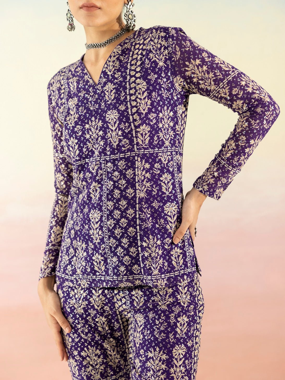 Shop purple embellished V-neck style kurta online in USA with flared pants. Make a fashion statement on festive occasions and weddings with designer suits, Indian dresses, Anarkali suits, palazzo suits, designer gowns, sharara suits from Pure Elegance Indian fashion store in USA.-closeup