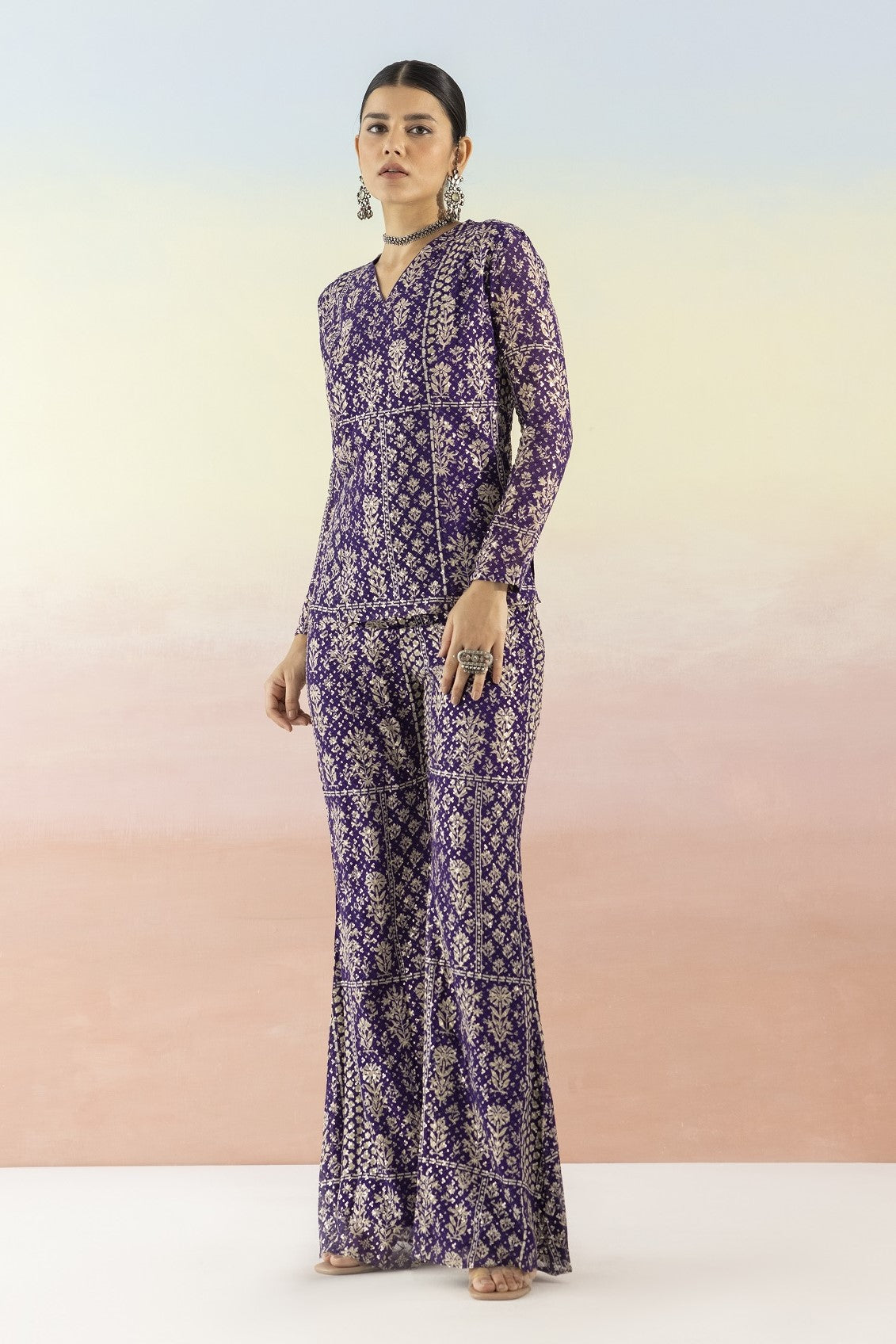 Shop purple embellished V-neck style kurta online in USA with flared pants. Make a fashion statement on festive occasions and weddings with designer suits, Indian dresses, Anarkali suits, palazzo suits, designer gowns, sharara suits from Pure Elegance Indian fashion store in USA.-full view