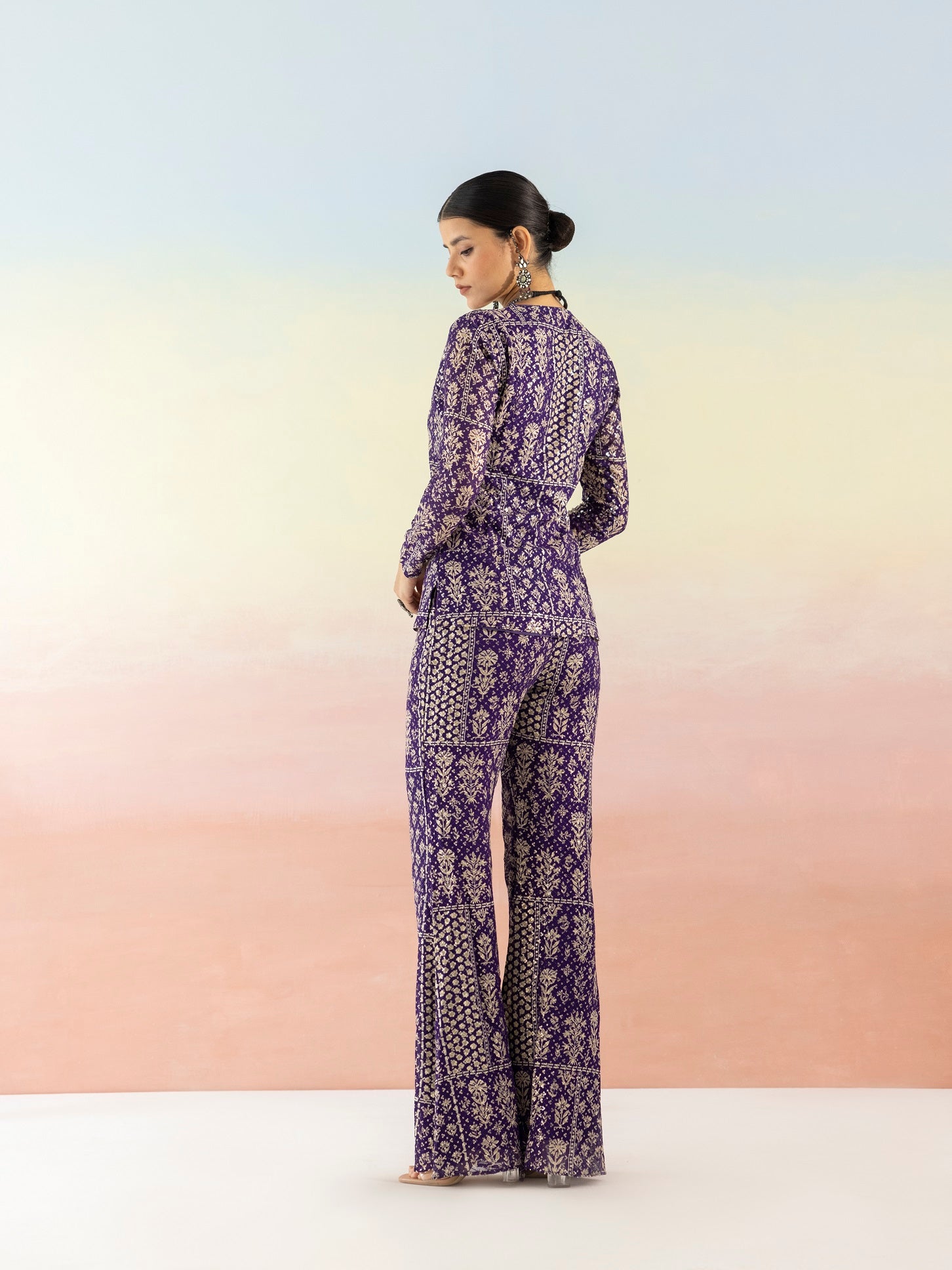 Shop purple embellished V-neck style kurta online in USA with flared pants. Make a fashion statement on festive occasions and weddings with designer suits, Indian dresses, Anarkali suits, palazzo suits, designer gowns, sharara suits from Pure Elegance Indian fashion store in USA.-back