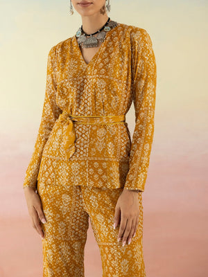 Buy beautiful mustard embellished V-neck style kurta online in USA with flared pants. Make a fashion statement on festive occasions and weddings with designer suits, Indian dresses, Anarkali suits, palazzo suits, designer gowns, sharara suits from Pure Elegance Indian fashion store in USA.-closeup