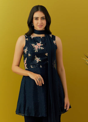 Buy beautiful navy blue embroidered peplum sharara suit online in USA with dupatta. Dazzle on weddings and special occasions with exquisite Indian designer dresses, sharara suits, Anarkali suits, bridal lehengas, sharara suits from Pure Elegance Indian clothing store in USA.-closeup