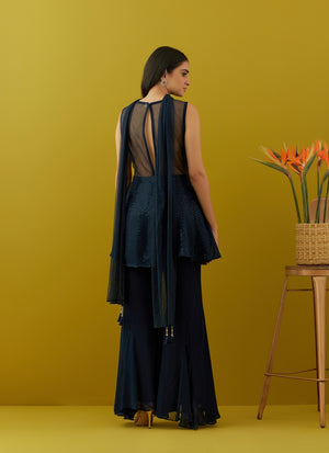 Buy beautiful navy blue embroidered peplum sharara suit online in USA with dupatta. Dazzle on weddings and special occasions with exquisite Indian designer dresses, sharara suits, Anarkali suits, bridal lehengas, sharara suits from Pure Elegance Indian clothing store in USA.-back