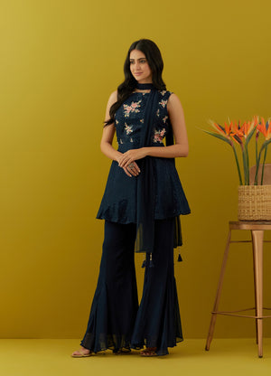 Buy beautiful navy blue embroidered peplum sharara suit online in USA with dupatta. Dazzle on weddings and special occasions with exquisite Indian designer dresses, sharara suits, Anarkali suits, bridal lehengas, sharara suits from Pure Elegance Indian clothing store in USA.-side