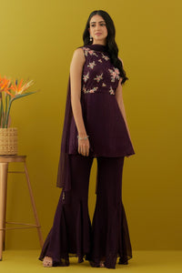 Shop beautiful wine embroidered peplum sharara suit online in USA with dupatta. Dazzle on weddings and special occasions with exquisite Indian designer dresses, sharara suits, Anarkali suits, bridal lehengas, sharara suits from Pure Elegance Indian clothing store in USA.-full view
