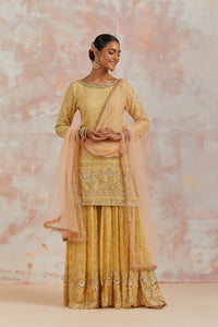 Shop beautiful yellow embroidered sharara suit online in USA with dupatta. Dazzle on weddings and special occasions with exquisite Indian designer dresses, sharara suits, Anarkali suits, bridal lehengas, sharara suits from Pure Elegance Indian clothing store in USA.-full view
