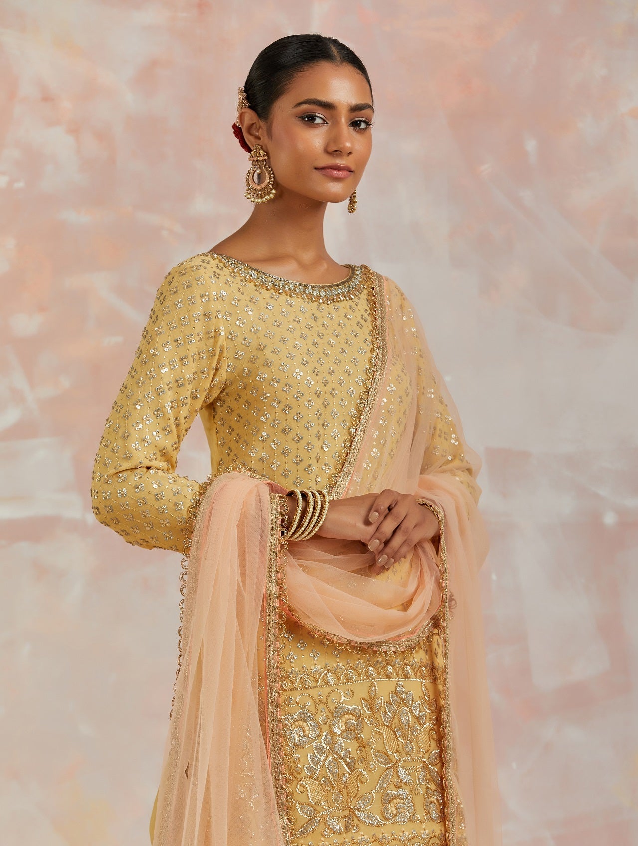 Shop beautiful yellow embroidered sharara suit online in USA with dupatta. Dazzle on weddings and special occasions with exquisite Indian designer dresses, sharara suits, Anarkali suits, bridal lehengas, sharara suits from Pure Elegance Indian clothing store in USA.-closeup