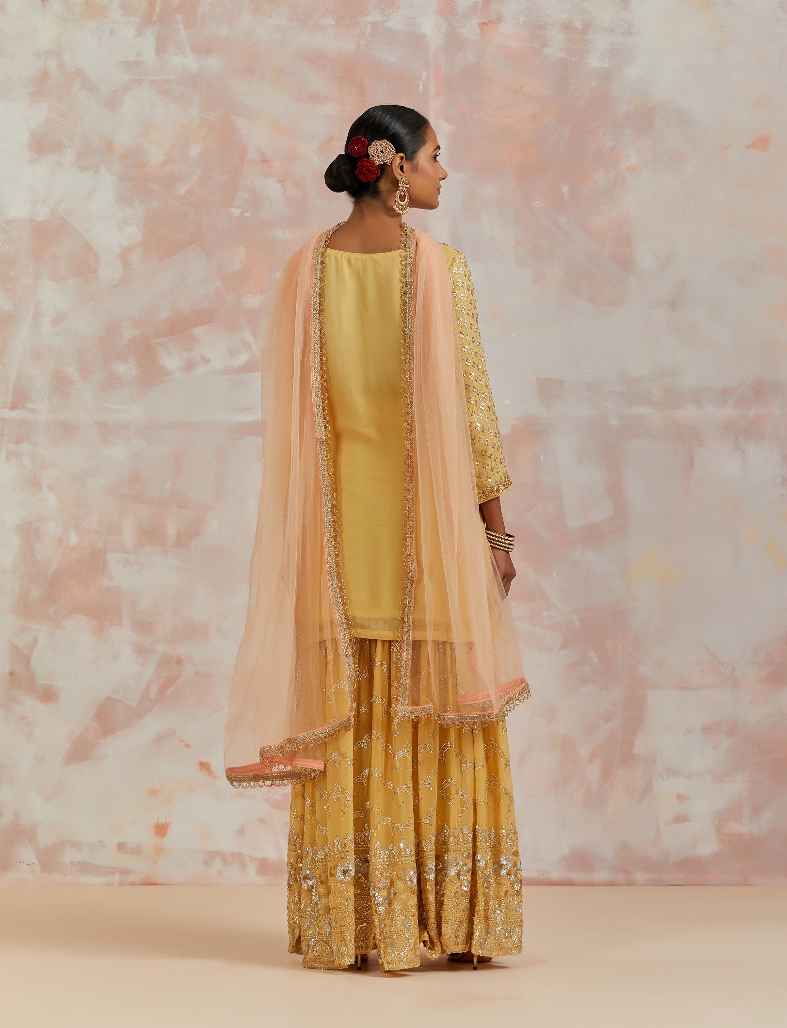 Shop beautiful yellow embroidered sharara suit online in USA with dupatta. Dazzle on weddings and special occasions with exquisite Indian designer dresses, sharara suits, Anarkali suits, bridal lehengas, sharara suits from Pure Elegance Indian clothing store in USA.-back