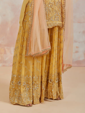 Shop beautiful yellow embroidered sharara suit online in USA with dupatta. Dazzle on weddings and special occasions with exquisite Indian designer dresses, sharara suits, Anarkali suits, bridal lehengas, sharara suits from Pure Elegance Indian clothing store in USA.-sharara