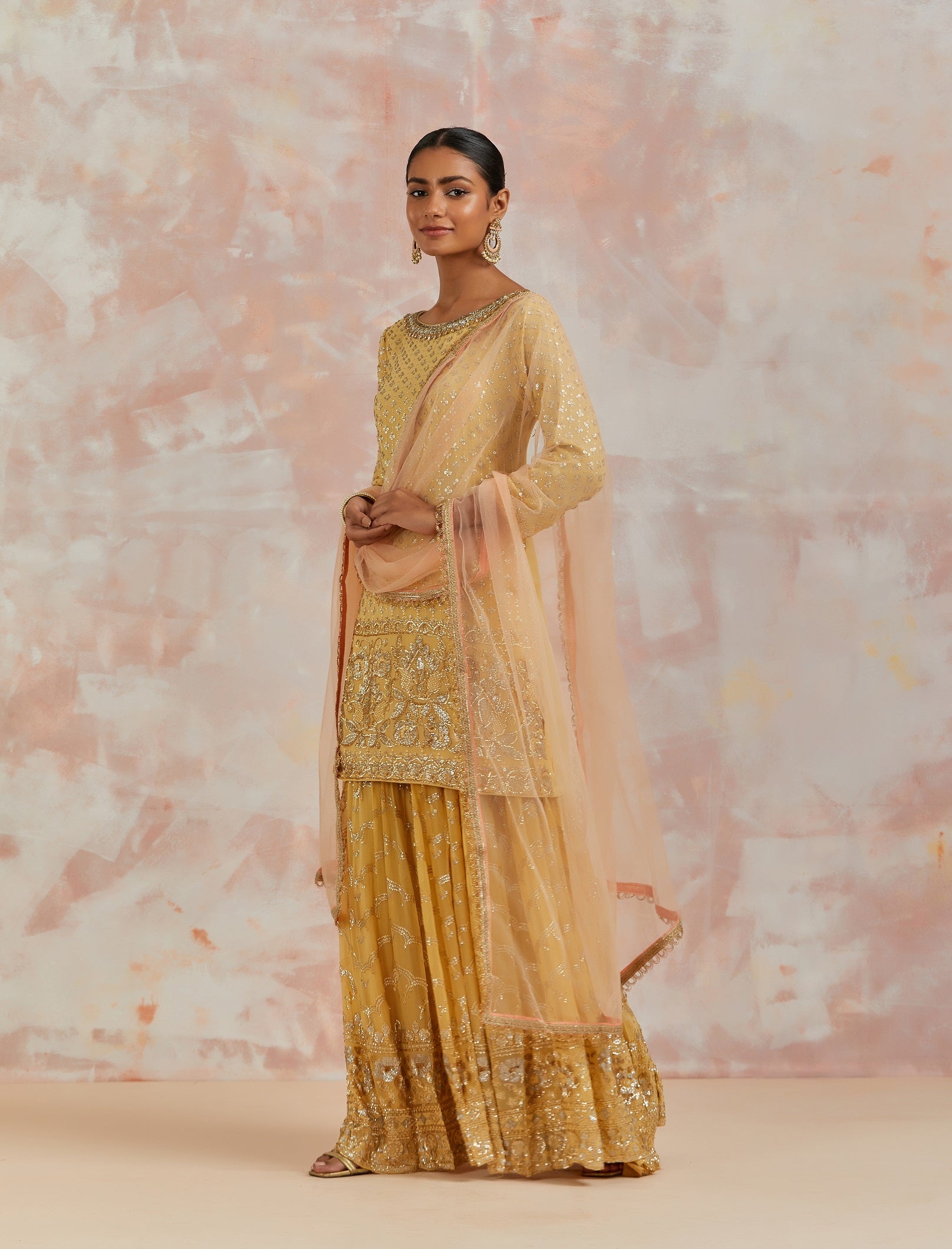 Shop beautiful yellow embroidered sharara suit online in USA with dupatta. Dazzle on weddings and special occasions with exquisite Indian designer dresses, sharara suits, Anarkali suits, bridal lehengas, sharara suits from Pure Elegance Indian clothing store in USA.-side