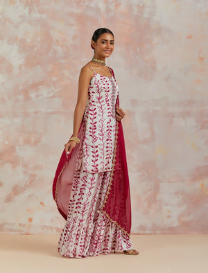 Shop beautiful white and pink modal satin printed sharara suit online in USA. Dazzle on weddings and special occasions with exquisite Indian designer dresses, sharara suits, Anarkali suits, bridal lehengas, sharara suits from Pure Elegance Indian clothing store in USA.-side