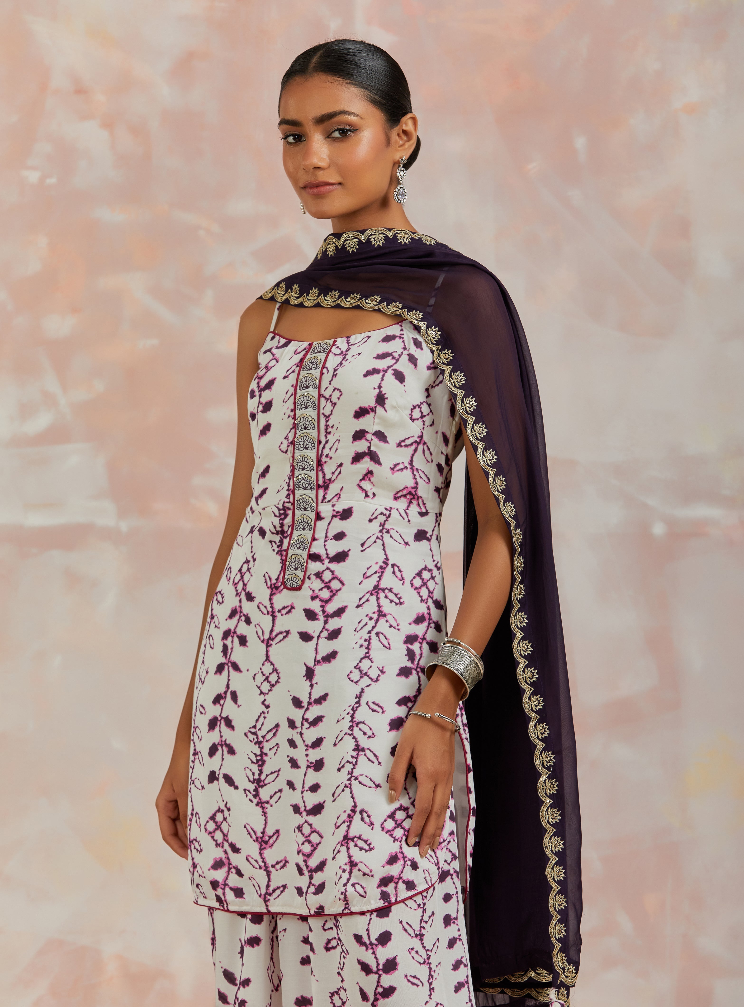 Shop beautiful white and purple modal satin printed sharara suit online in USA. Dazzle on weddings and special occasions with exquisite Indian designer dresses, sharara suits, Anarkali suits, bridal lehengas, sharara suits from Pure Elegance Indian clothing store in USA.-closeup