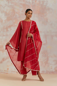 Buy beautiful red muslin suit online in USA with gota work and butterfly sleeves. Dazzle on weddings and special occasions with exquisite Indian designer dresses, sharara suits, Anarkali suits, bridal lehengas, sharara suits from Pure Elegance Indian clothing store in USA.-full view