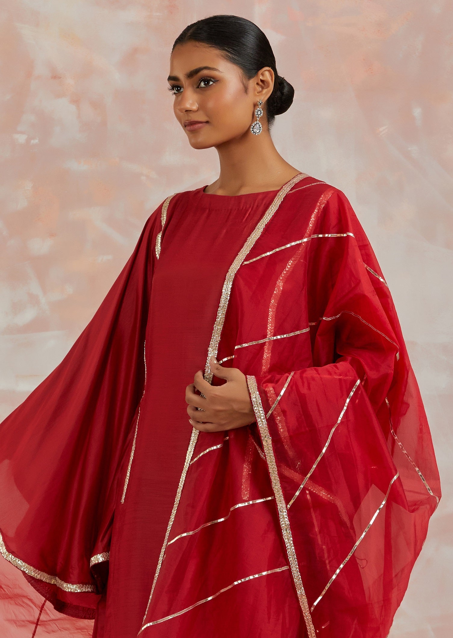 Buy beautiful red muslin suit online in USA with gota work and butterfly sleeves. Dazzle on weddings and special occasions with exquisite Indian designer dresses, sharara suits, Anarkali suits, bridal lehengas, sharara suits from Pure Elegance Indian clothing store in USA.-closeup