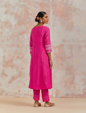 Shop beautiful rani pink chanderi cotton suit online in USA with pants and dupatta. Dazzle on weddings and special occasions with exquisite Indian designer dresses, sharara suits, Anarkali suits, bridal lehengas, sharara suits from Pure Elegance Indian clothing store in USA.-back