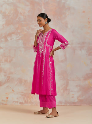 Shop beautiful rani pink chanderi cotton suit online in USA with pants and dupatta. Dazzle on weddings and special occasions with exquisite Indian designer dresses, sharara suits, Anarkali suits, bridal lehengas, sharara suits from Pure Elegance Indian clothing store in USA.-side