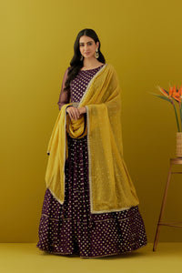 Shop beautiful plum sequin embroidery georgette Anarkali online in USA with yellow dupatta. Dazzle on weddings and special occasions with exquisite Indian designer dresses, sharara suits, Anarkali suits, bridal lehengas, sharara suits from Pure Elegance Indian clothing store in USA.-full view
