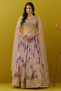 Buy beautiful powder pink tie and dye sequin embroidery lehenga online in USA with attached dupatta. Dazzle on weddings and special occasions with exquisite Indian designer dresses, sharara suits, Anarkali suits, bridal lehengas, sharara suits from Pure Elegance Indian clothing store in USA.-front