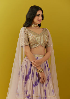 Buy beautiful powder pink tie and dye sequin embroidery lehenga online in USA with attached dupatta. Dazzle on weddings and special occasions with exquisite Indian designer dresses, sharara suits, Anarkali suits, bridal lehengas, sharara suits from Pure Elegance Indian clothing store in USA.-side