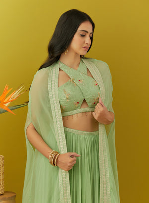 Shop green embroidered bustier online in USA with sharara and cape. Dazzle on weddings and special occasions with exquisite Indian designer dresses, sharara suits, Anarkali suits, bridal lehengas, sharara suits from Pure Elegance Indian clothing store in USA.-closeup