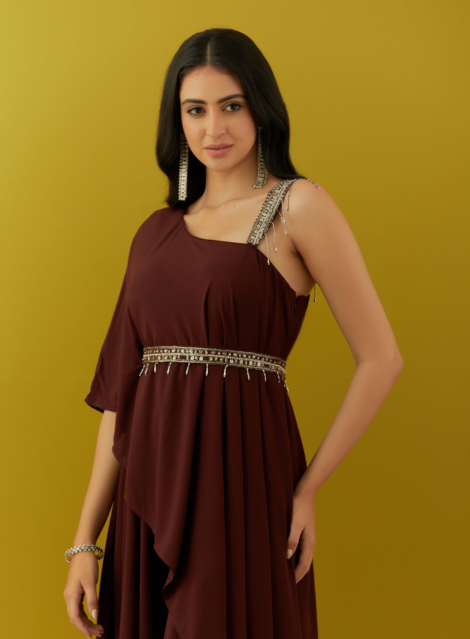 Shop beautiful wine asymmetric jumpsuit online in USA with embroidered belt. Dazzle on weddings and special occasions with exquisite Indian designer dresses, sharara suits, Anarkali suits, bridal lehengas, sharara suits from Pure Elegance Indian clothing store in USA.-closeup
