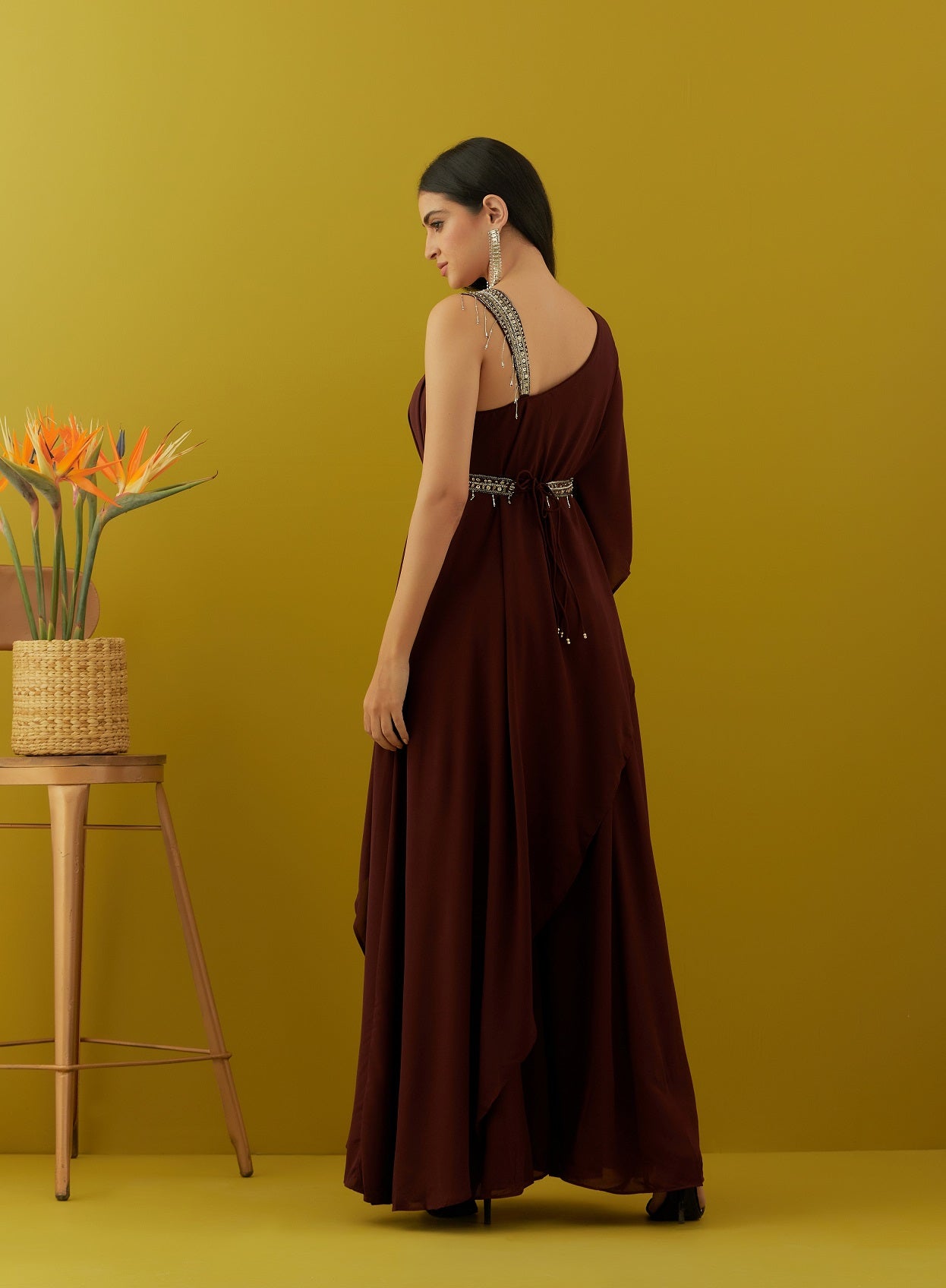 Shop beautiful wine asymmetric jumpsuit online in USA with embroidered belt. Dazzle on weddings and special occasions with exquisite Indian designer dresses, sharara suits, Anarkali suits, bridal lehengas, sharara suits from Pure Elegance Indian clothing store in USA.-back
