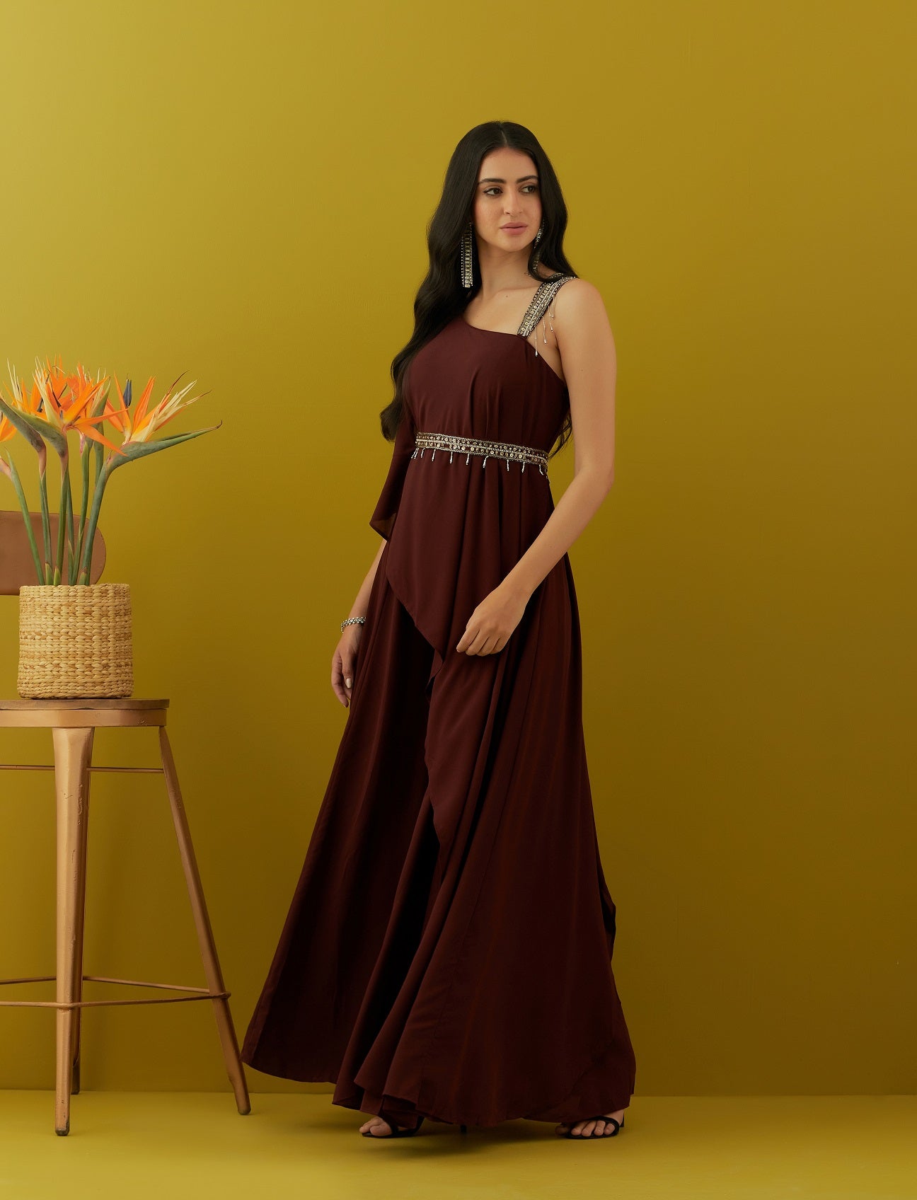 Shop beautiful wine asymmetric jumpsuit online in USA with embroidered belt. Dazzle on weddings and special occasions with exquisite Indian designer dresses, sharara suits, Anarkali suits, bridal lehengas, sharara suits from Pure Elegance Indian clothing store in USA.-side