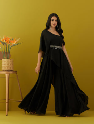 Buy black asymmetric jumpsuit online in USA with embroidered belt. Dazzle on weddings and special occasions with exquisite Indian designer dresses, sharara suits, Anarkali suits, bridal lehengas, sharara suits from Pure Elegance Indian clothing store in USA.-front