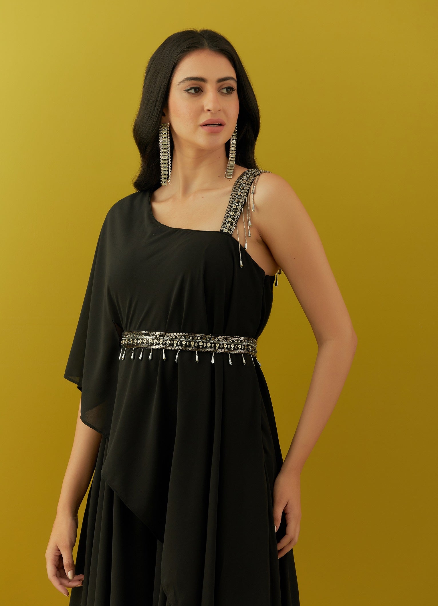 Buy black asymmetric jumpsuit online in USA with embroidered belt. Dazzle on weddings and special occasions with exquisite Indian designer dresses, sharara suits, Anarkali suits, bridal lehengas, sharara suits from Pure Elegance Indian clothing store in USA.-closeup