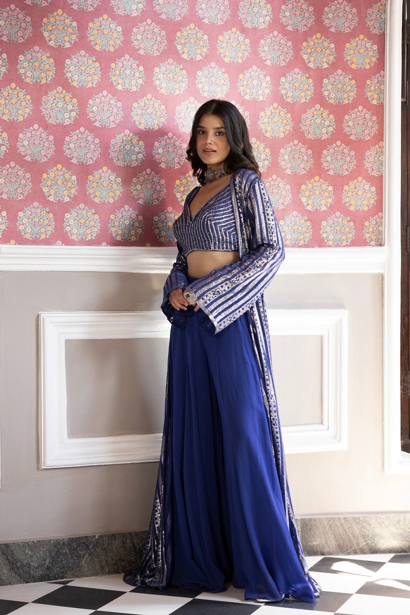 Shop beautiful blue embroidered crop top with sharara online in USA with jacket. Dazzle on weddings and special occasions with exquisite Indian designer dresses, sharara suits, Anarkali suits, bridal lehengas, sharara suits from Pure Elegance Indian clothing store in USA.-side